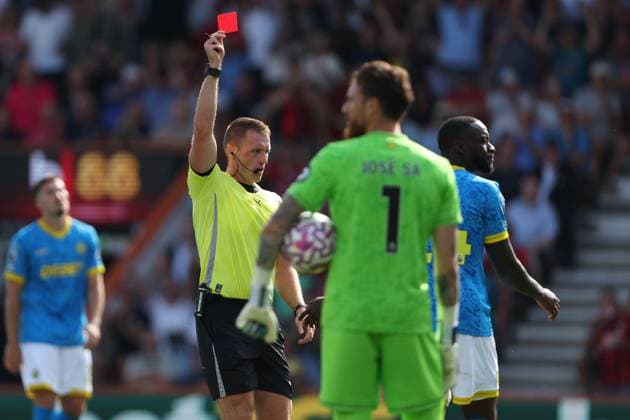 Football - 2025 2026 Premier League - AFC Bournemouth vs Wolverhampton Wanderers - The Vitality Stadium - Saturday 23rd August 2025 Referee Mr Thomas Bramall shows a red card to Toti Gomes of Wolverhampton during the Premier League match at the Vitality Stadium COLORSPORT Shaun Boggust 