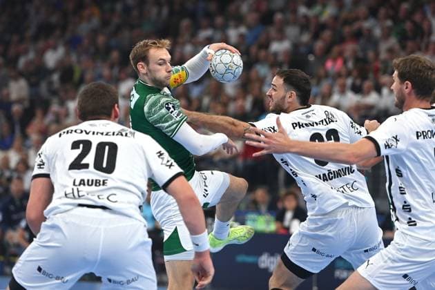 Sport Bilder des Tages Mathias GIDSEL (Fuechse Berlin) , Aktion,Zweikampf gegen Veron NACINOVIC (Kiel) . Handball Super Cup 2025 der Maenner Fuechse Berlin vs. THW Kiel am 23.08.2025, SAP GARDEN Muenchen.
