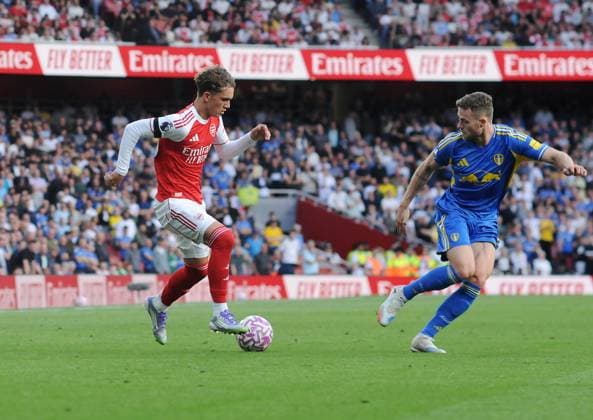 Football - 2025 2026 Premier League - Arsenal vs Leeds United - Emirates Stadium - Saturday 23rd August 2025 15 year old Max Robert Dowman of Arsenal after coming on to make his Premiership Debut, takes on Gabriel Gudmundsson 