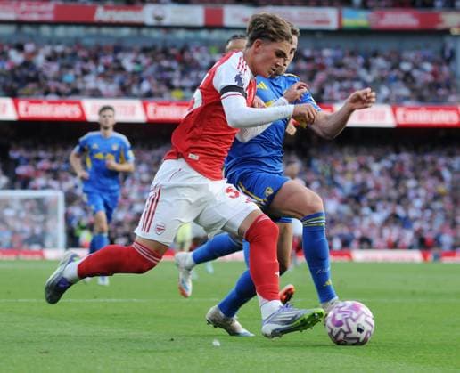 Football - 2025 2026 Premier League - Arsenal vs Leeds United - Emirates Stadium - Saturday 23rd August 2025 15 year old Max Robert Dowman of Arsenal after coming on to make his Premiership Debut, takes on Gabriel Gudmundsson 