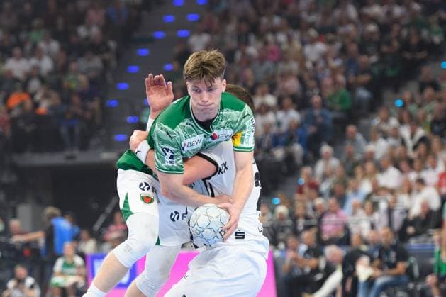 Nils Lichtlein (17 Füchse Berlin) is stopped by a player from THW Kiel during the DHB Supercup match between Füchse Berlin and THW Kiel, SAP Garden, Munich, Germany. (Sven Beyrich SPP) Copyright: xSvenxBeyrich SPPx spp-en-SvBe-SvBe-20250823-ND5_2267