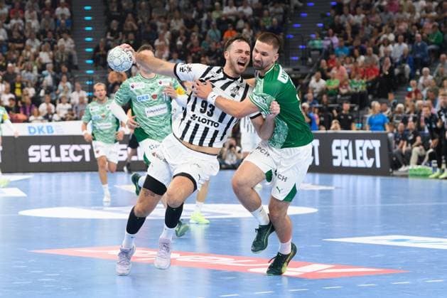 Veron Nacinovic (93 THW Kiel) and Fabian Wiede (3 Füchse Berlin) during the DHB Supercup match between Füchse Berlin and THW Kiel, SAP Garden, Munich, Germany. (Sven Beyrich SPP) Copyright: xSvenxBeyrich SPPx spp-en-SvBe-SvBe-20250823-ND5_2285