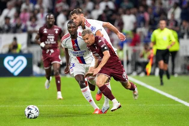 Olympique Lyonnais v FC Metz - Ligue 1 McDonald s 2025 2026 22 Clinton MATA PEDRO LOURENCO (ol) - 06 Tanner TESSMANN (ol) - 10 Gauthier HEIN (fcm) during Ligue 1 McDonald s match between Lyon and Metz at Groupama Stadium on August 23, 2025 in Lyon, France. Lyon France  Copyright: xFEPx 776370858