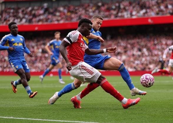 London, England, 23rd August 2025. Bukayo Saka of Arsenal tussles with Gabriel Gudmundsson of Leeds United during the Arsenal vs Leeds United Premier League match at the Emirates Stadium, London. Picture credit should read: David Klein Sportimage EDITORIAL USE ONLY. No use with unauthorised audio, video, data, fixture lists, club league logos or live services. Online in-match use limited to 120 images, no video emulation. No use in betting, games or single club league player publications. SPI_059_DK_Arsenal_Leeds SPI-4090-0058