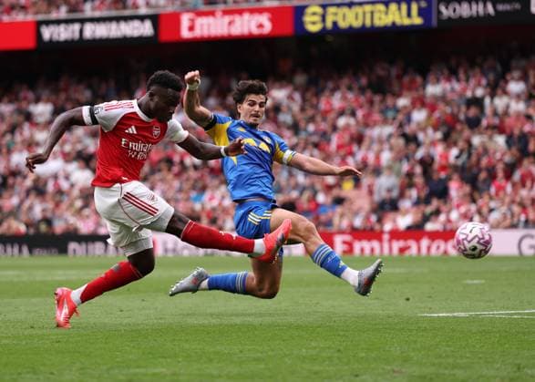 London, England, 23rd August 2025. Bukayo Saka of Arsenal scoring his sides second goal during the Arsenal vs Leeds United Premier League match at the Emirates Stadium, London. Picture credit should read: David Klein Sportimage EDITORIAL USE ONLY. No use with unauthorised audio, video, data, fixture lists, club league logos or live services. Online in-match use limited to 120 images, no video emulation. No use in betting, games or single club league player publications. SPI_071_DK_Arsenal_Leeds SPI-4090-0071