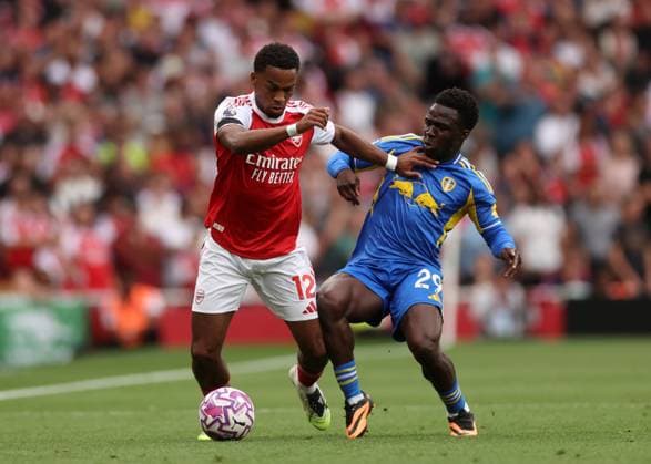 London, England, 23rd August 2025. Jurrien Timber of Arsenal with Wilfried Gnonto of Leeds United during the Arsenal vs Leeds United Premier League match at the Emirates Stadium, London. Picture credit should read: David Klein Sportimage EDITORIAL USE ONLY. No use with unauthorised audio, video, data, fixture lists, club league logos or live services. Online in-match use limited to 120 images, no video emulation. No use in betting, games or single club league player publications. SPI_117_DK_Arsenal_Leeds SPI-4090-0090