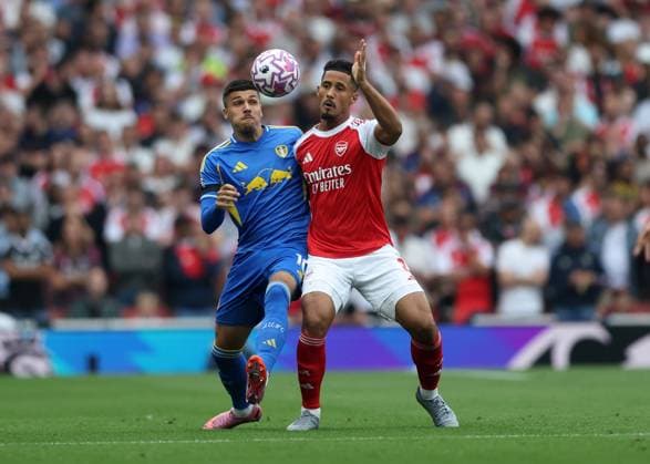 London, England, 23rd August 2025. William Saliba of Arsenal with JoÃ«l Piroe of Leeds United during the Arsenal vs Leeds United Premier League match at the Emirates Stadium, London. Picture credit should read: David Klein Sportimage EDITORIAL USE ONLY. No use with unauthorised audio, video, data, fixture lists, club league logos or live services. Online in-match use limited to 120 images, no video emulation. No use in betting, games or single club league player publications. SPI_098_DK_Arsenal_Leeds SPI-4090-0107