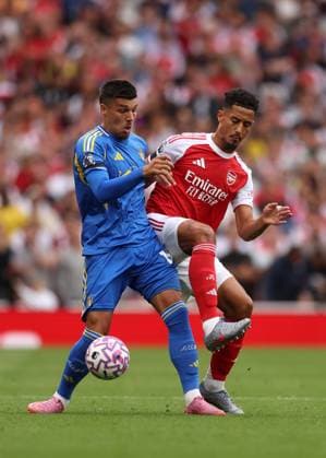 London, England, 23rd August 2025. William Saliba of Arsenal with JoÃ«l Piroe of Leeds United during the Arsenal vs Leeds United Premier League match at the Emirates Stadium, London. Picture credit should read: David Klein Sportimage EDITORIAL USE ONLY. No use with unauthorised audio, video, data, fixture lists, club league logos or live services. Online in-match use limited to 120 images, no video emulation. No use in betting, games or single club league player publications. SPI_112_DK_Arsenal_Leeds SPI-4090-0130
