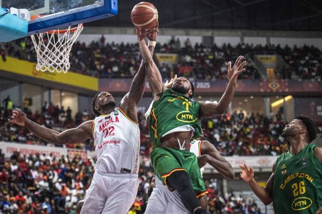 (250824) -- LUANDA, Aug. 24, 2025 -- Cameroon s Tamenang Choh (top R) vies for a rebound with Angola s Silvio Sousa (L) during the semifinal between Angola and Cameroon at the 2025 FIBA AfroBasket in Luanda, Angola, Aug. 23, 2025. ) (SP)ANGOLA-LUANDA-BASKETBALL-FIBA AFROBASKET-SEMIFINAL-ANG VS CMR WangxGuansen 