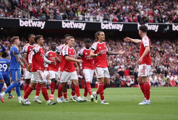 Arsenal players walk towards Declan Rice (A) after his corner led to the goal scored by Jurrien Timber (A) at the Arsenal v Leeds United EPL match, at the Emirates Stadium, London, UK on 23rd August, 2025. 
