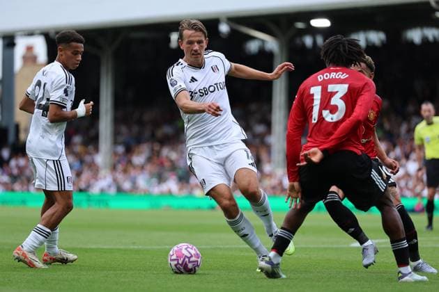 24th August 2025; Craven Cottage, Fulham, London, England; Premier League Football, Fulham versus Manchester United, ManU Sander Berge of Fulham closely marked by Patrick Dorgu of Manchester United  JohnxPatrickxFletcher