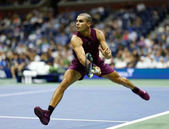 Carlos Alcaraz of Spain returns a ball in the second set before defeating Reilly Opelka in the first round in Arthur Ashe Stadium on day 2 at the 2025 US Open Tennis Championship at the USTA Billie Jean King National Tennis Center in New York City on Monday, August 25, 2025.  NYP20250825143 JOHNxANGELILLO