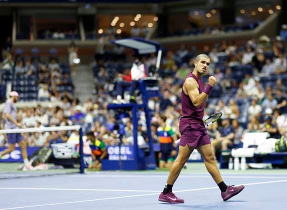 Carlos Alcaraz of Spain celebrates after winning a point in the third set before defeating Reilly Opelka in the first round in Arthur Ashe Stadium on day 2 at the 2025 US Open Tennis Championship at the USTA Billie Jean King National Tennis Center in New York City on Monday, August 25, 2025.  NYP20250825144 JOHNxANGELILLO