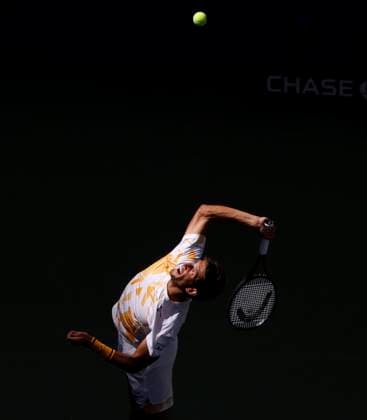 Vit Kopriva of Czechia serves to Jannik Sinner of Italy in the 3rd set of their first round match in Arthur Ashe Stadium on day 3 at the 2025 US Open Tennis Championship at the USTA Billie Jean King National Tennis Center in New York City on Tuesday, August 26, 2025.  NYP20250826130 JOHNxANGELILLO
