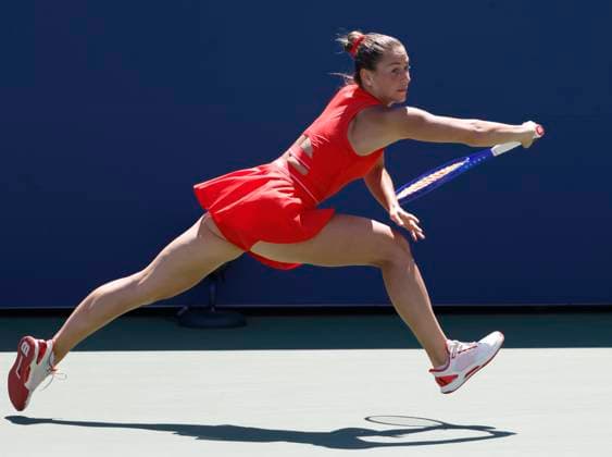 Marta Kostyuk of Ukraine returns a ball to Katie.Boulter of United Kingdom in the second set of their first round match in the Grandstand court on day 3 at the 2025 US Open Tennis Championship at the USTA Billie Jean King National Tennis Center in New York City on Tuesday, August 26, 2025. Kostyuk defeated Boulter in straight sets.  NYP20250826111 JOHNxANGELILLO