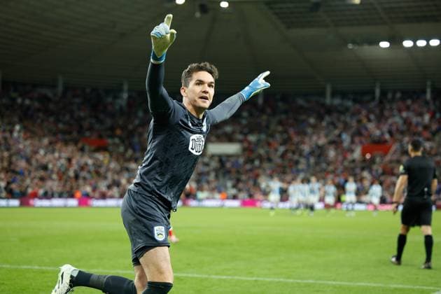26th August 2025; Stadium of Light, Sunderland, England; EFL Carabao Cup Football, Sunderland versus Huddersfield Town; Lee Nicholls of Huddersfield Town saves a penalty kick as Huddersfield go into the next round Editorial use only: DataCo restrictions apply See www.football-dataco.com  CraigxCowan