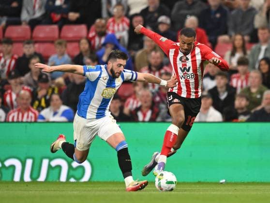 Lynden Gooch of Huddersfield Town (left) and Wilson Isidor of Sunderland Sunderland v Huddersfield Town, EFL Carabao Cup, Second Round, Football, Stadium of Light, Sunderland, UK - 26 Aug 2025Sunderland Stadium of Light United Kingdom EDITORIAL USE ONLY No use with unauthorised audio, video, data, fixture lists, club league logos or live services. Online in-match use limited to 120 images, no video emulation. No use in betting, games or single club league player publications.  Copyright: xRichardxLee Shutterstockx 15455838bm