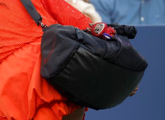 Naomi Osaka of Japan has a Labubu hanging from her bag when she arrives on the court after she is introduced before her first round match against Greet Minnen of Belgium in Louis Armstrong Stadium on day 3 at the 2025 US Open Tennis Championship at the USTA Billie Jean King National Tennis Center in New York City on Tuesday, August 26, 2025.  NYP20250826141 JOHNxANGELILLO
