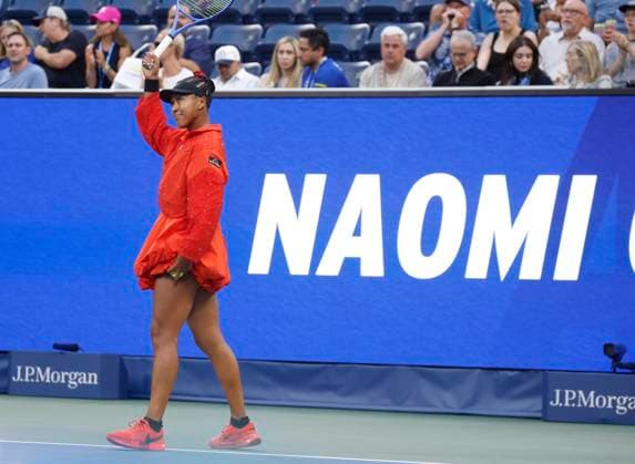 Naomi Osaka of Japan reacts to fans when she is introduced before her first round match against Greet Minnen of Belgium in Louis Armstrong Stadium on day 3 at the 2025 US Open Tennis Championship at the USTA Billie Jean King National Tennis Center in New York City on Tuesday, August 26, 2025.  NYP20250826149 JOHNxANGELILLO