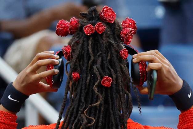 Naomi Osaka of Japan removes her headphones before she warms up on the court in her first round match against Greet Minnen of Belgium in Louis Armstrong Stadium on day 3 at the 2025 US Open Tennis Championship at the USTA Billie Jean King National Tennis Center in New York City on Tuesday, August 26, 2025.  NYP20250826154 JOHNxANGELILLO