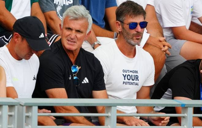 A member of the Stefanos Tsitsipas team with a t-shirt reading Outwork Your Potential 2025 US Open, Day Three, USTA Billie Jean King National Tennis Center, New York, USA - 26 Aug 2025New York USTA Billie Jean King National T New York (NY) United States of America  Copyright: xJavierxGarcia Shutterstockx 15451865gx