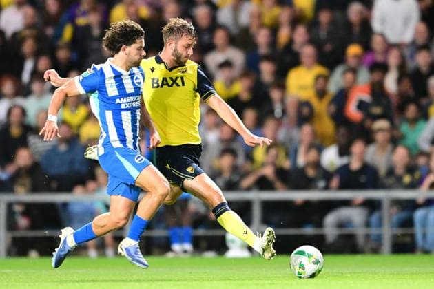 Oxford United v Brighton and Hove Albion EFL Cup 27 08 2025. Oxford United midfielder Stanley Mills (17) shoots under pressure from Brighton and Hove Albion defender Ferdi KadÄ±oÄülu during the EFL Cup match between Oxford United and Brighton and Hove Albion at the Kassam Stadium, Oxford, England on 27 August 2025. Oxford Kassam Stadium Oxfordshire England Editorial use only DataCo restrictions apply See www.football-dataco.com , Copyright: xDennisxGoodwinx PSI-22704-0013