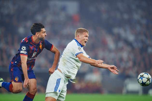 Champions League qualifier: FC Copenhagen - FC Basel 1893 Andreas Cornelius, FC Copenhagen and FC Basel s Nicolas Vouilloz vies for the ball during the Champions League qualifying match between FC Copenhagen and FC Basel 1893 at Parken in Copenhagen on Wednesday, August 27, 2025. , Copenhagen Denmark Copyright: Ritzau Scanpix LiselottexSabroex spdk20250827-215852-L