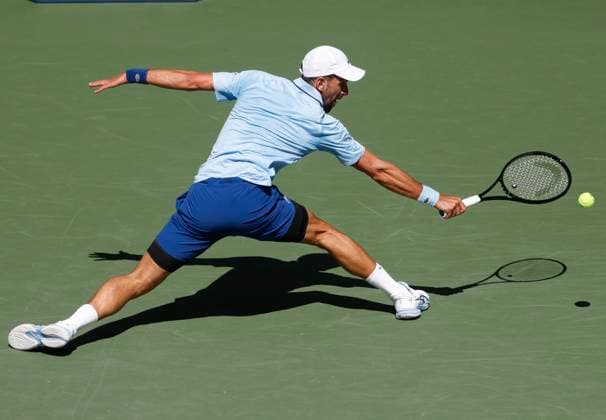Novak Djokovic of Serbia returns a ball in the first set before defeating Zachary Svajda in 4 sets in his second round match in Arthur Ashe Stadium on day 4 at the 2025 US Open Tennis Championship at the USTA Billie Jean King National Tennis Center in New York City on Wednesday, August 27, 2025.  NYP20250827106 JOHNxANGELILLO