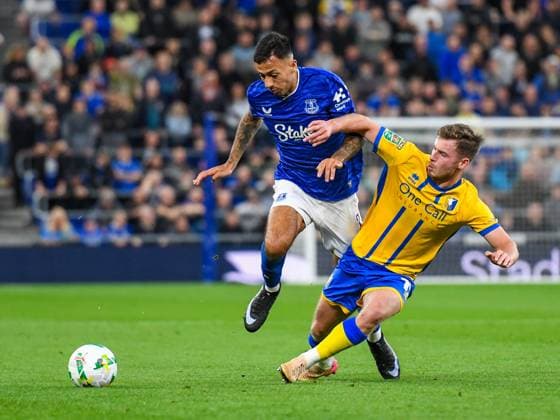 Everton v Mansfield Town Carabao Cup Jamie McDonnell and Dwight McNeil of Everton battles for the ball during the Carabao Cup Second Round match at the Hill Dickson Stadium, Liverpool UK Newspapers OUT Copyright: xKarlxVallantinex FIL-22149-0081