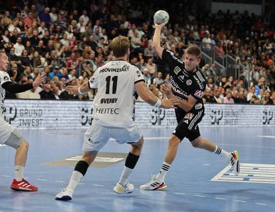 28.08.2025 - Handball - 1. Bundesliga DAIKIN HBL - Saison 2025 2026 - 01. Spieltag: HC Erlangen Metropolregion Nürnberg HCE - THW Kiel - DaMa - xdaxmax - Petter Overby (11, THW Kiel ) Sander Andreassen Overjordet ( 8, HC Erlangen HCE )