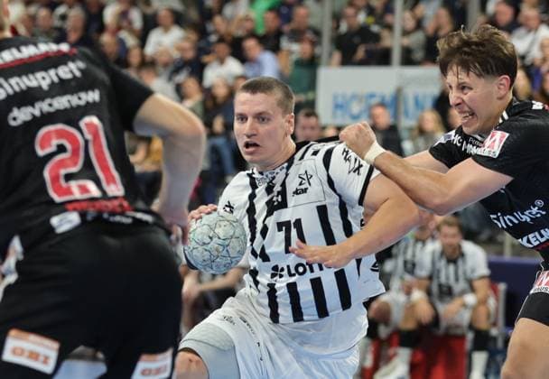 28.08.2025 - Handball - 1. Bundesliga DAIKIN HBL - Saison 2025 2026 - 01. Spieltag: HC Erlangen Metropolregion Nürnberg HCE - THW Kiel - DaMa - xdaxmax - Christopher Bissel (21, HC Erlangen HCE ) Elias Ellefsen a Skipagotu (71, THW Kiel ) Florian Scheerer (10, HC Erlangen HCE )