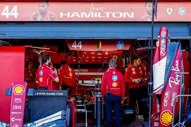 Scuderia Ferrari mechanics working on the car of Lewis Hamilton in the pit box during the Formula 1 Heineken Dutch Grand Prix 2025 on Day 1 at Circuit Zandvoort on August 29, 2025 in Zandvoort, Netherlands. (Photo by Marcel ter Bals DeFodi Images)