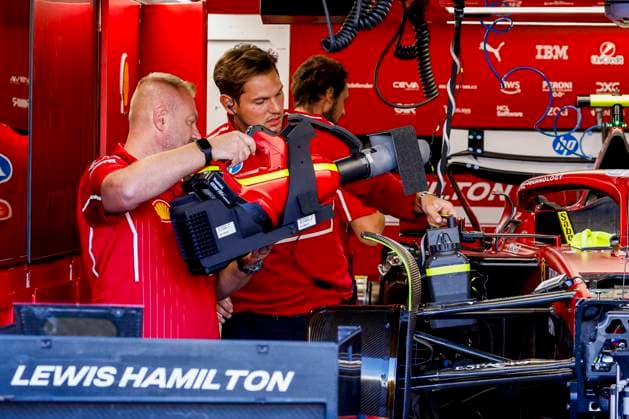 Scuderia Ferrari mechanics working on the car of Lewis Hamilton in the pit box during the Formula 1 Heineken Dutch Grand Prix 2025 on Day 1 at Circuit Zandvoort on August 29, 2025 in Zandvoort, Netherlands. (Photo by Marcel ter Bals DeFodi Images)