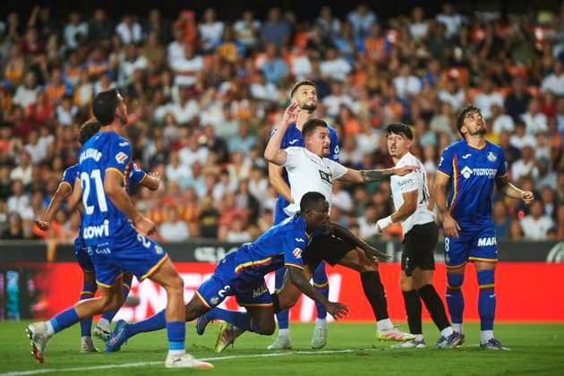 Baptiste Santamaria (Valencia CF) and Djene Nekounam (Getafe CF) during the LaLiga EA Sports match between Valencia CF and Getafe CF at Estadio de Mestalla on August 29, 2025 in Valencia, Spain. (Photo by Maria Jose Segovia DeFodi Images)
