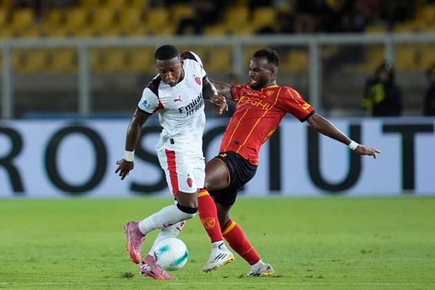 Pervis Estupinan (AC Milan) and Lassana Coulibaly (US Lecce) battle for the ball, Serie A, US Lecce v AC Milan, Via del Mare Stadium, August 29, 2025, Lecce, Italy.