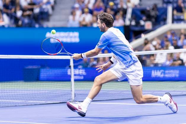 Cameron Norrie of Great Britain returns a ball to Novak Djokovic of Serbia in the third round in Arthur Ashe Stadium on day 6 at the 2025 US Open Tennis Championship at the USTA Billie Jean King National Tennis Center in New York City on Friday, August 29, 2025.  NYP20250829807 COREYxSIPKIN