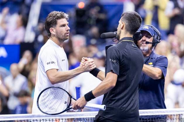 Cameron Norrie of Great Britain (l.) congratulates Novak Djokovic of Serbia on his win in 4 sets in the third round in Arthur Ashe Stadium on day 6 at the 2025 US Open Tennis Championship at the USTA Billie Jean King National Tennis Center in New York City on Friday, August 29, 2025.  NYP20250829831 COREYxSIPKIN