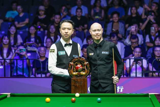 WUHAN, CHINA - AUGUST 30: Xiao Guodong (L) of China and Gary Wilson of England pose with the trophy prior to the Final match on day 7 of the 2025 Wuhan Open at Optics Valley Gymnasium of HUST on August 30, 2025 in Wuhan, Hubei Province of China.  Copyright: xTaixChengzhex 111587811793