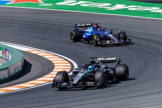 George Russell of the United Kingdom and Mercedes AMG Petronas F1 Team and Alexander Albon of Thailand and Williams during the Free Practice of the Formula 1 Heineken Dutch Grand Prix 2025 on Day 2 at Circuit Zandvoort on August 30, 2025 in Zandvoort, Netherlands. (Photo by Marcel ter Bals DeFodi Images)