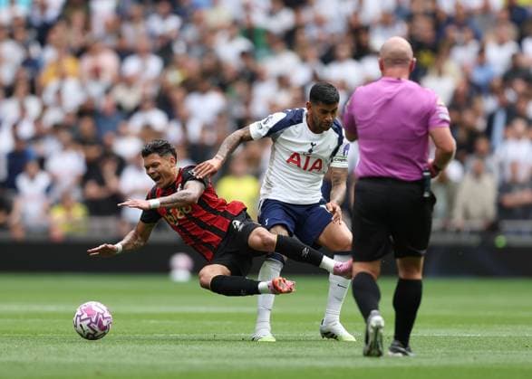 30th August 2025; Tottenham Hotspur Stadium, London, England; Premier League Football, Tottenham Hotspur versus Bournemouth; Cristian Romero of Tottenham Hotspur tackles Evanilson of AFC Bournemouth in front of Referee Simon Hooper  JohnxPatrickxFletcher