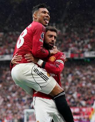 Manchester, England, 30th August 2025. Casemiro of Manchester United, ManU (L) celebrates with Bruno Fernandes of Manchester United after scoring the opening goal during the Manchester United vs Burnley Premier League match at Old Trafford, Manchester. Picture credit should read: Andrew Yates Sportimage EDITORIAL USE ONLY. No use with unauthorised audio, video, data, fixture lists, club league logos or live services. Online in-match use limited to 120 images, no video emulation. No use in betting, games or single club league player publications. SPI_017_AY_MANUTD_BURNLEY SPI-4095-0018