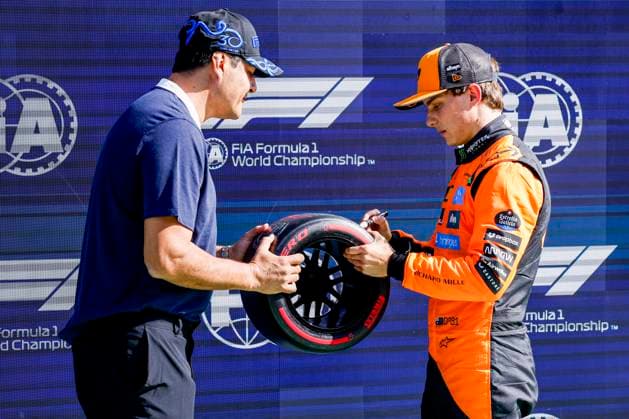 Julio Ricardo Cruz of Argentina and Pole position qualifier Oscar Piastri of Australia and McLaren F1 Team with pole postion award competing in the Qualification of the Formula 1 Heineken Dutch Grand Prix 2025 on Day 2 at Circuit Zandvoort on August 30, 2025 in Zandvoort, Netherlands. (Photo by Marcel ter Bals DeFodi Images)