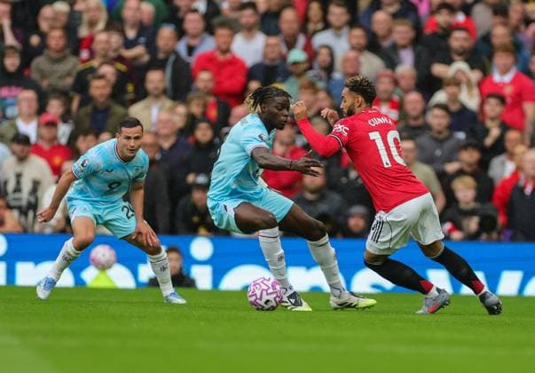 30th August 2025; Old Trafford, Manchester, England; Premier League Football, Manchester United, ManU versus Burnley;m Matheus Cunha of Manchester United tracked by Jaidon Anthony of Burnley  RogerxEvans