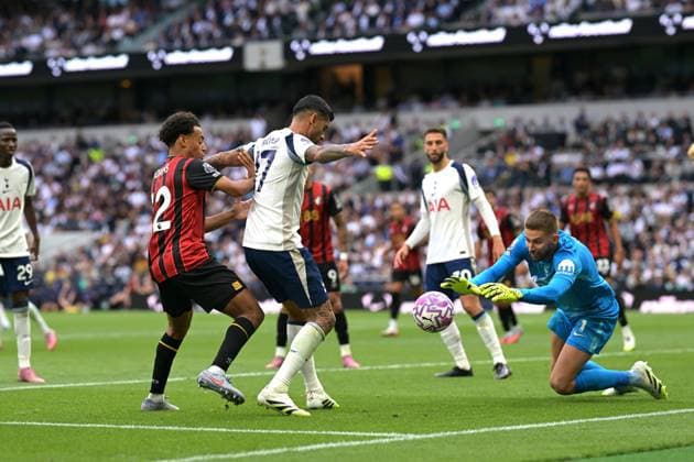 Spurs vs Bournemouth, Premier League Guglielmo Vicario Goalkeeper of Tottenham Hotspur saves from Tyler Adams of Bournemouth FC during the Spurs vs Bournemouth, Premier League match at the Tottenham Hotspur Stadium London. London Tottenham Hotspur Stadium UK Copyright: xMartinxDaltonx Spurs_Bournemouth_300825_MD_399