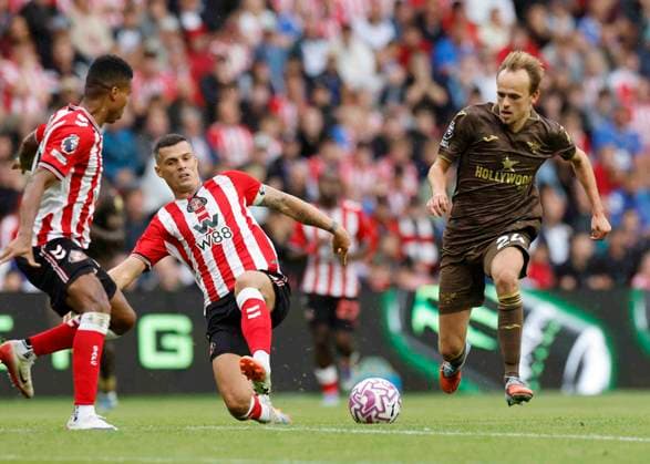 Sunderland v Brentford Premier League GranitÊXhaka of Sunderland (left) competes for the ball with Mikkel Damsgaard of Brentford during the Premier League match at the Stadium Of Light, Sunderland UK Newspapers OUT Copyright: xFredxPalmerx FIL-22162-0223