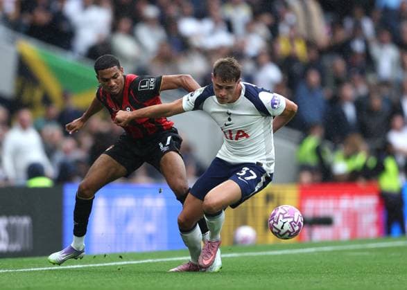 30th August 2025; Tottenham Hotspur Stadium, London, England; Premier League Football, Tottenham Hotspur versus Bournemouth; Micky van de Ven of Tottenham Hotspur challenged by Amine Adli of AFC Bournemouth  JohnxPatrickxFletcher