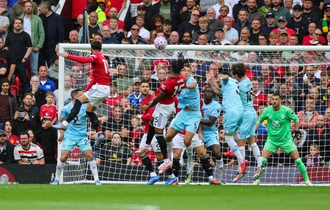 30th August 2025; Old Trafford, Manchester, England; Premier League Football, Manchester United, ManU versus Burnley; Leny Yoro of Manchester United heads at goal  RogerxEvans