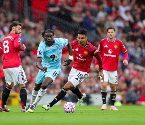 30th August 2025; Old Trafford, Manchester, England; Premier League Football, Manchester United, ManU versus Burnley;Lesley Ugochukwu of Burnley tracked by Casemiro of Manchester United  RogerxEvans