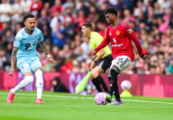30th August 2025; Old Trafford, Manchester, England; Premier League Football, Manchester United, ManU versus Burnley; Amad Diallo of Manchester United tracked by Maxime Esteve of Burnley  RogerxEvans