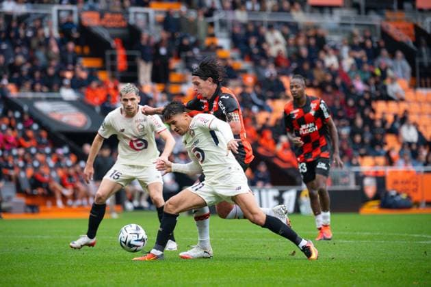 FOOTBALL : Lorient vs Lille - Ligue 1 - 30 08 2025 Osame Sahraoui ( 11 - Lille ) and Laurent Aubergel ( 6 - FC Lorient ) during the Ligue 1 match between FC Lorient and Lille OSC at Stade Yves Allainmat on August 30, 2025 in Lorient, France. ( Photo by Federico Pestellini PsnewZ ) - LorientFrance  Copyright: xFedericoxPestellinix